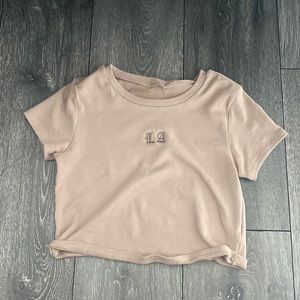 LA garage baby tee shirt! tag is not on but fit a small/medium best